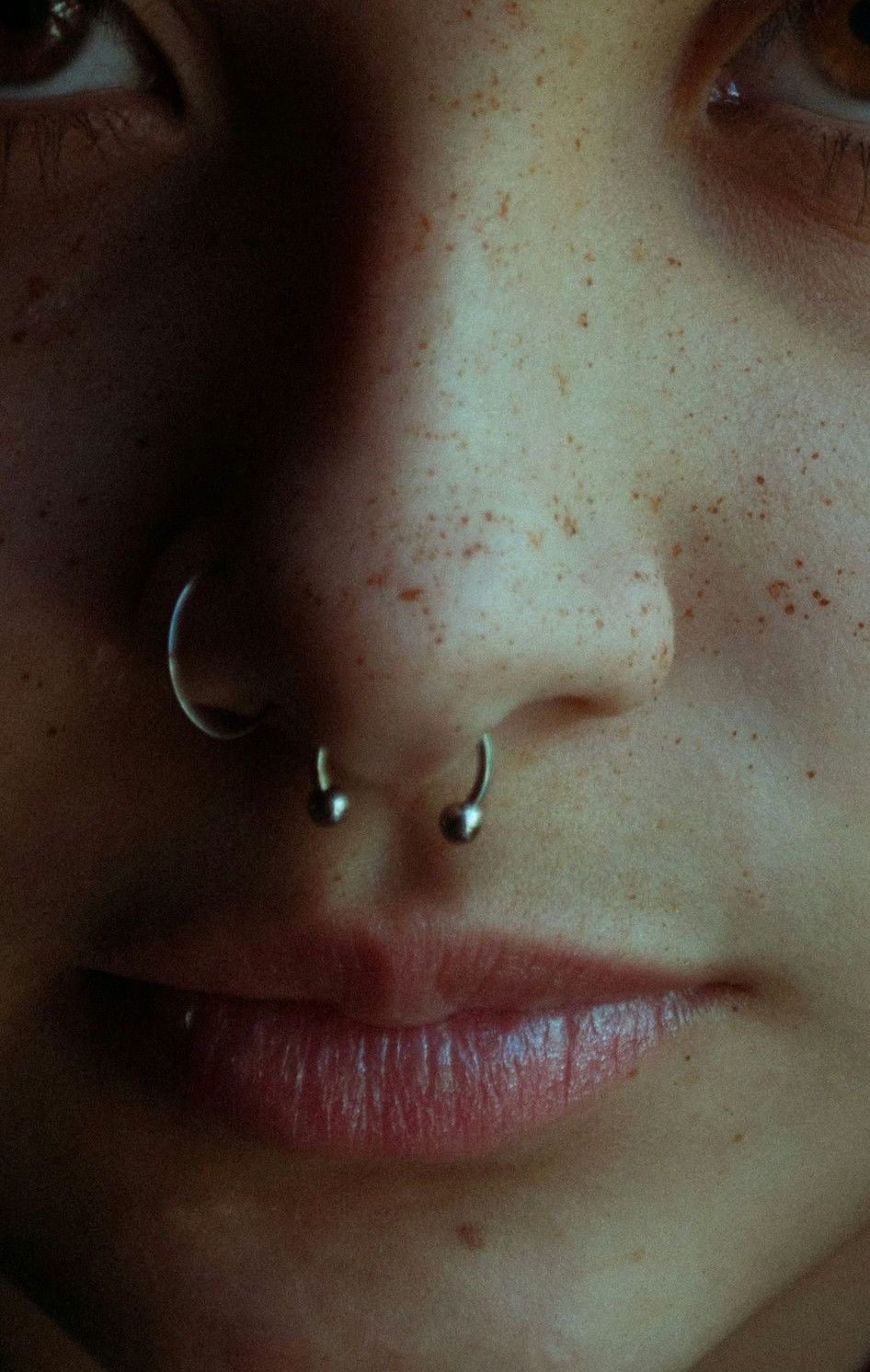 woman with silver stud earring